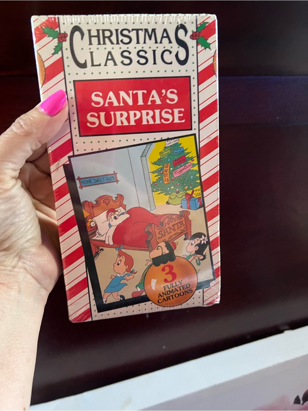 "Santa's Surprise" Kids Toy VHS-style Collectible - Red/White